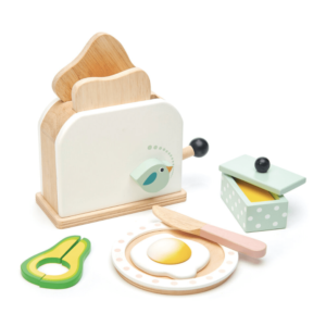 non toxic wood Kids Breakfast Toaster Set, Spring-loaded toaster,  2 slices of toast, butter dish with lid, avocado slice, sunny side up egg, a knife, and a plate. tender leaf toys