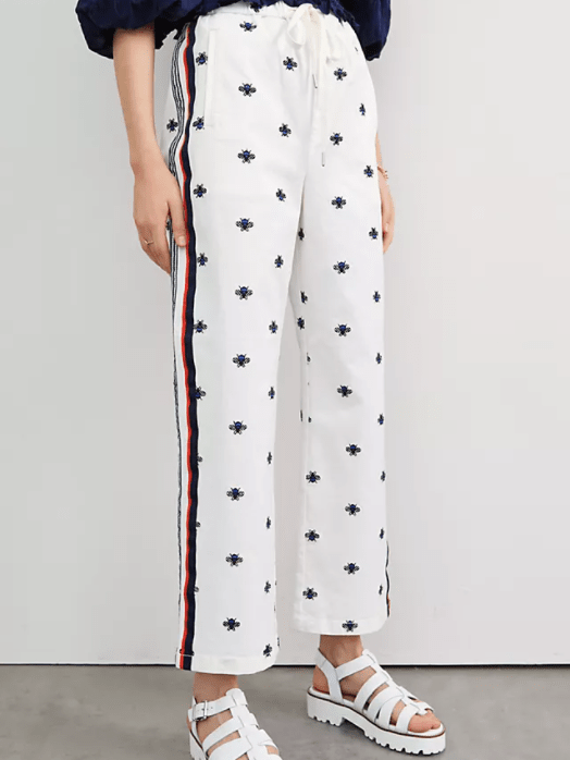Anthropologie cute track pants with navy embroidered bees