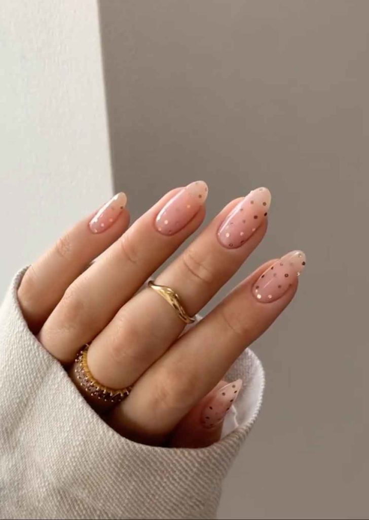 nude almond nails aesthetic with gold