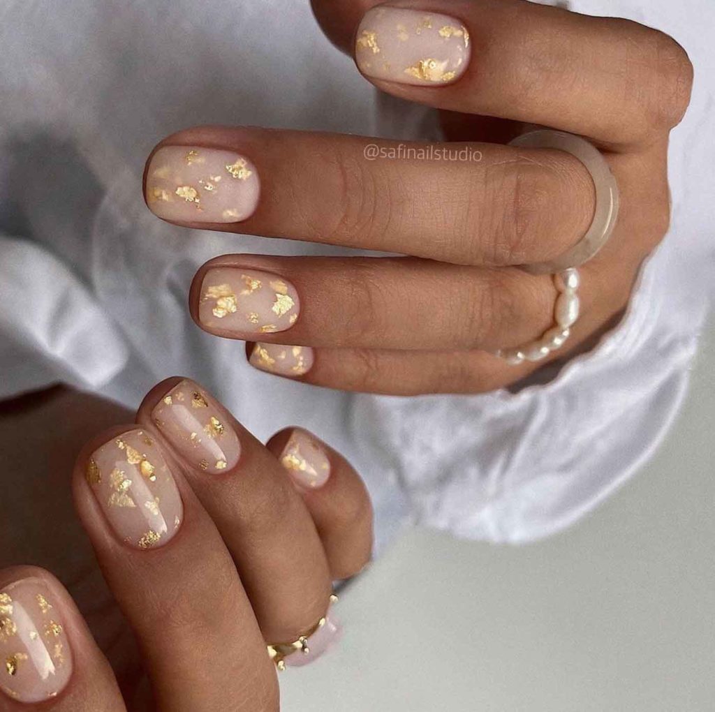 nude nails art with gold foil flakes, nail ideas