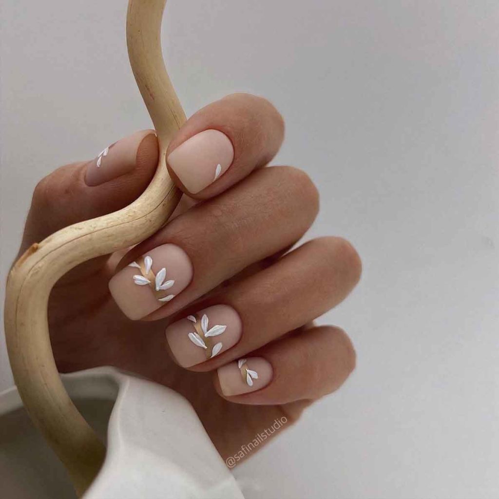white and gold nude nail design