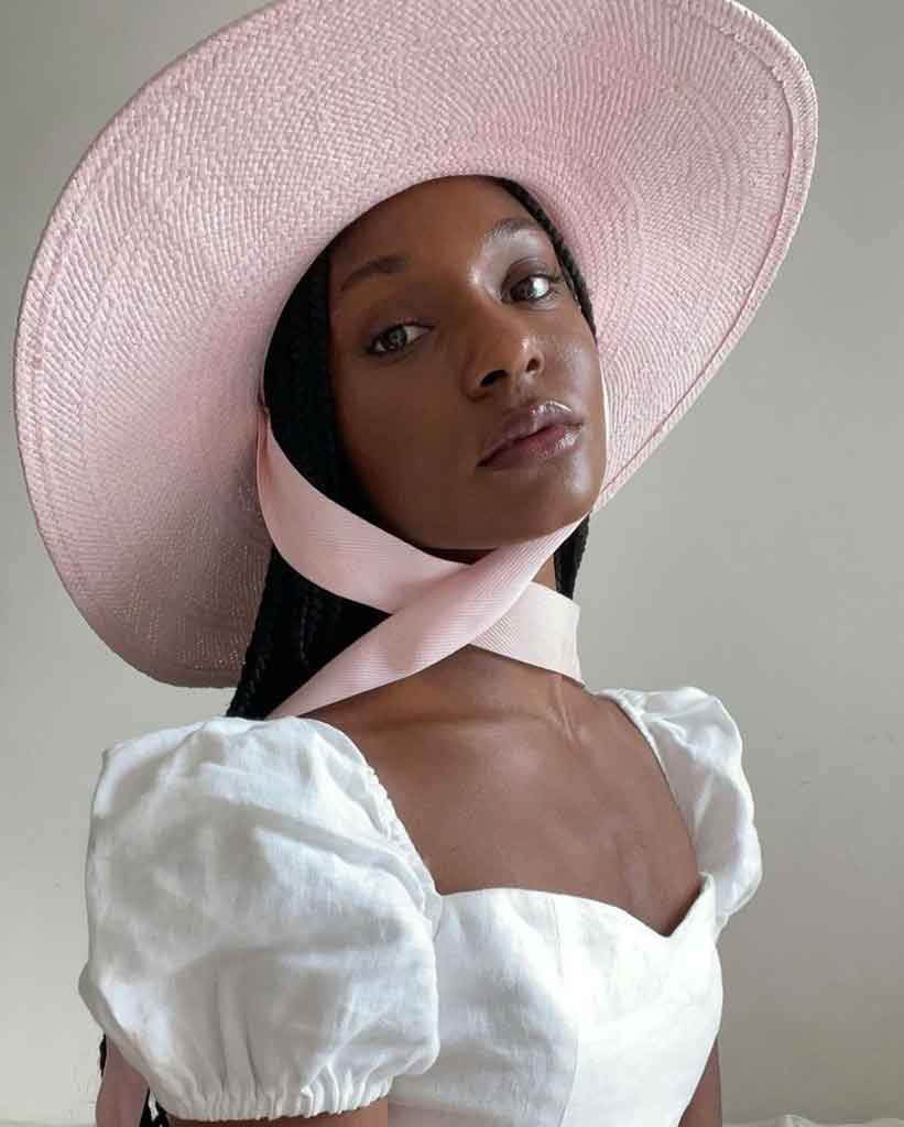 black woman pink hat