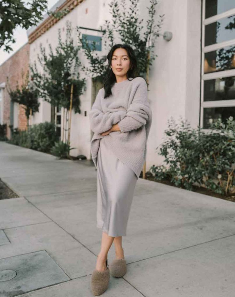 comfy aesthetic outfit sweater and silk skirt and slippers