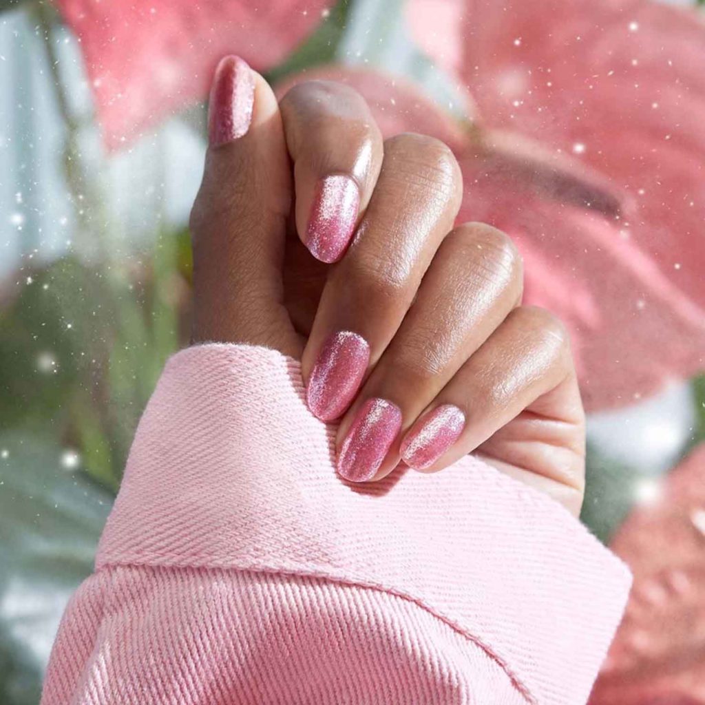 soft pink nails with glitter on dark skin